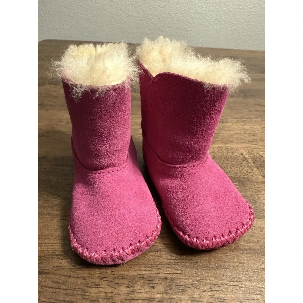 UGG Caden baby booties in fuchsia pink suede with sheepskin lining 0/1